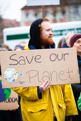 Man holding ´Save our planet´ placard