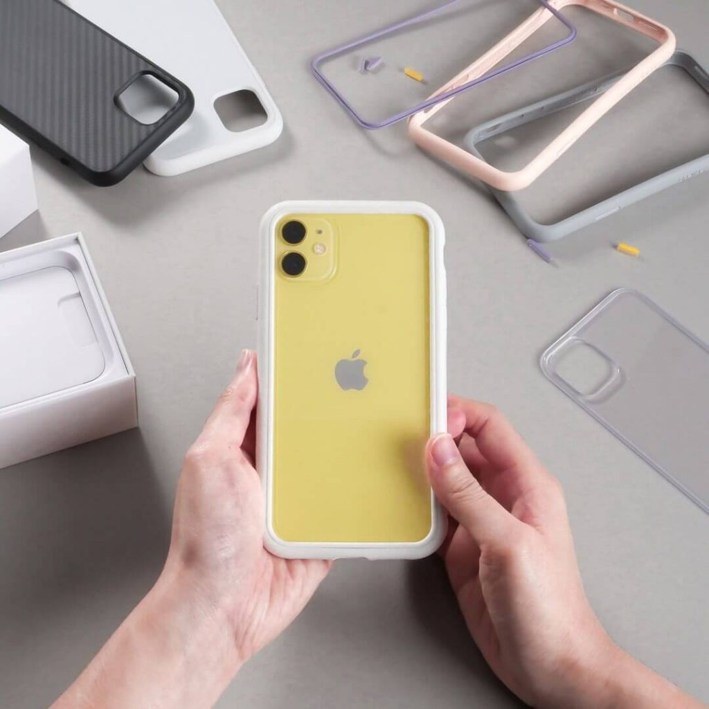 Yellow iPhone in a white CrashGuard NX fame by Rhionshield